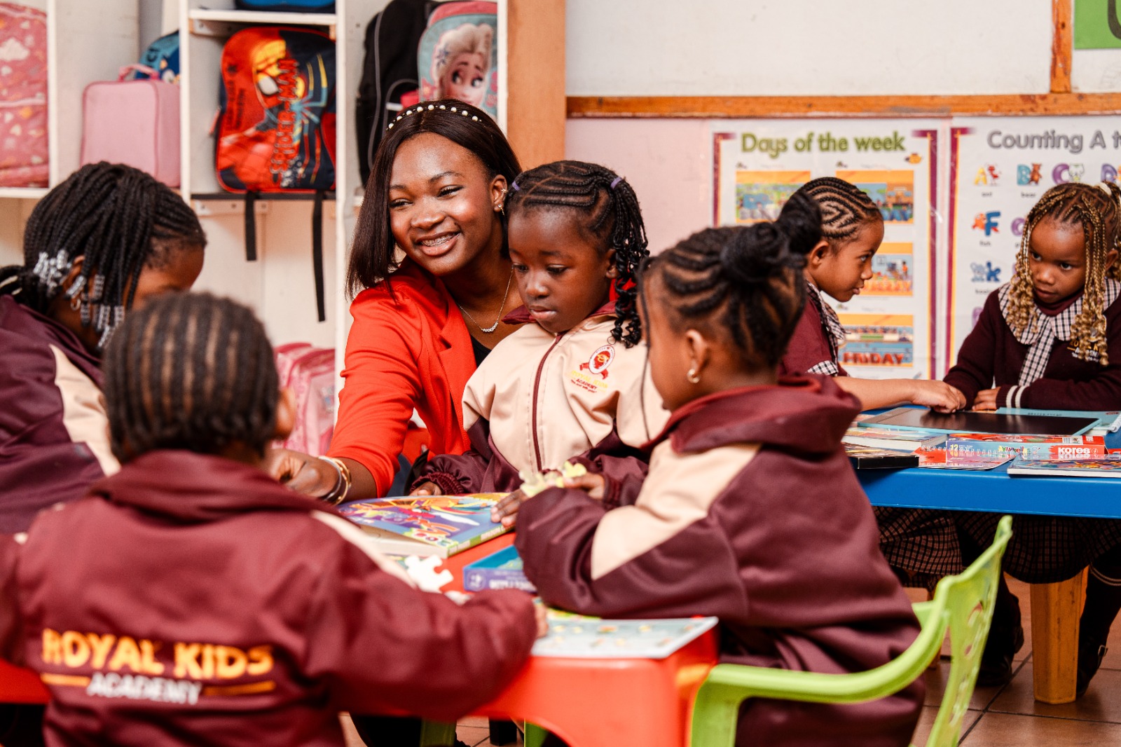 A teacher spending time with Pre-Primary pupils