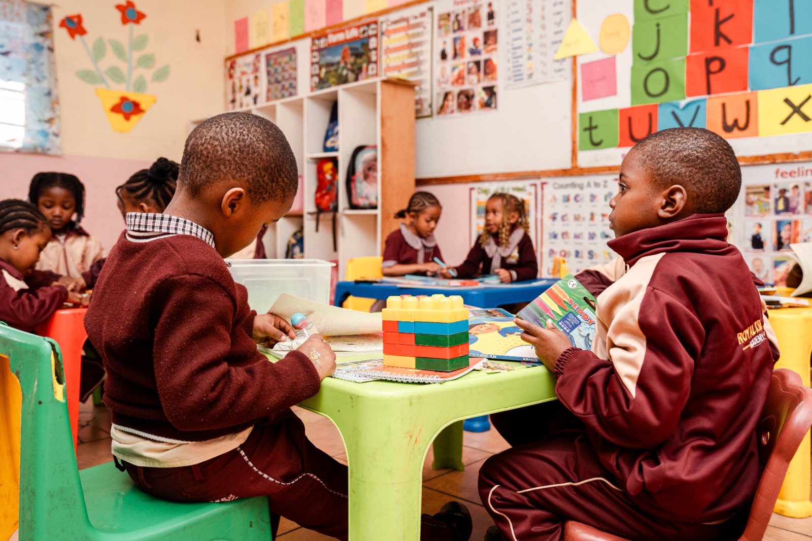 Royal Kids pupils playing with building blocks and puzzles in the classroom